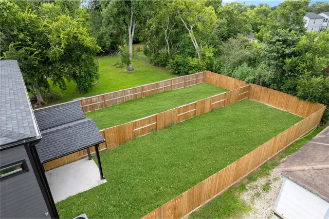a view of a two chairs in the backyard