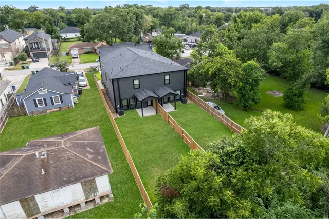 an aerial view of a house with a garden