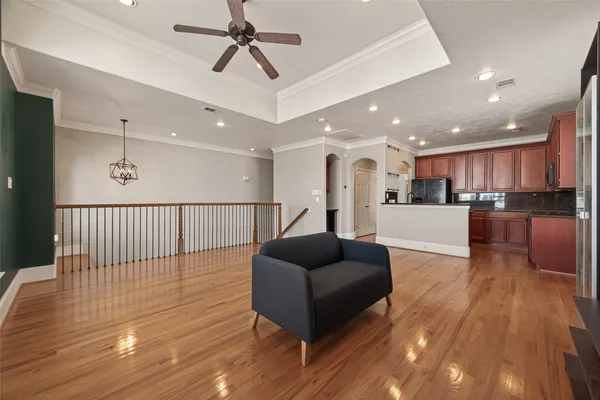 a view of kitchen with stainless steel appliances refrigerator stove microwave and cabinets