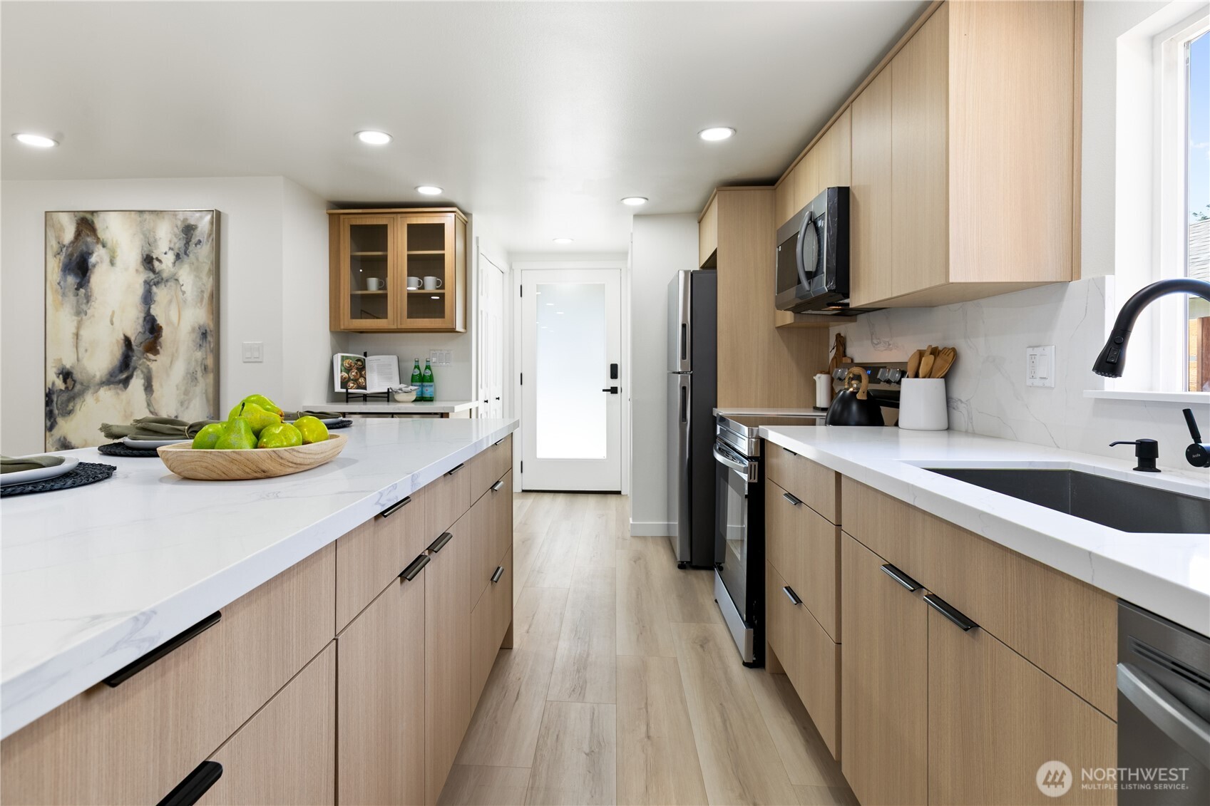 11 Southwest 100th Street Seattle, WA 98146 - Photo 14 of 36 a kitchen with a sink stove and cabinets