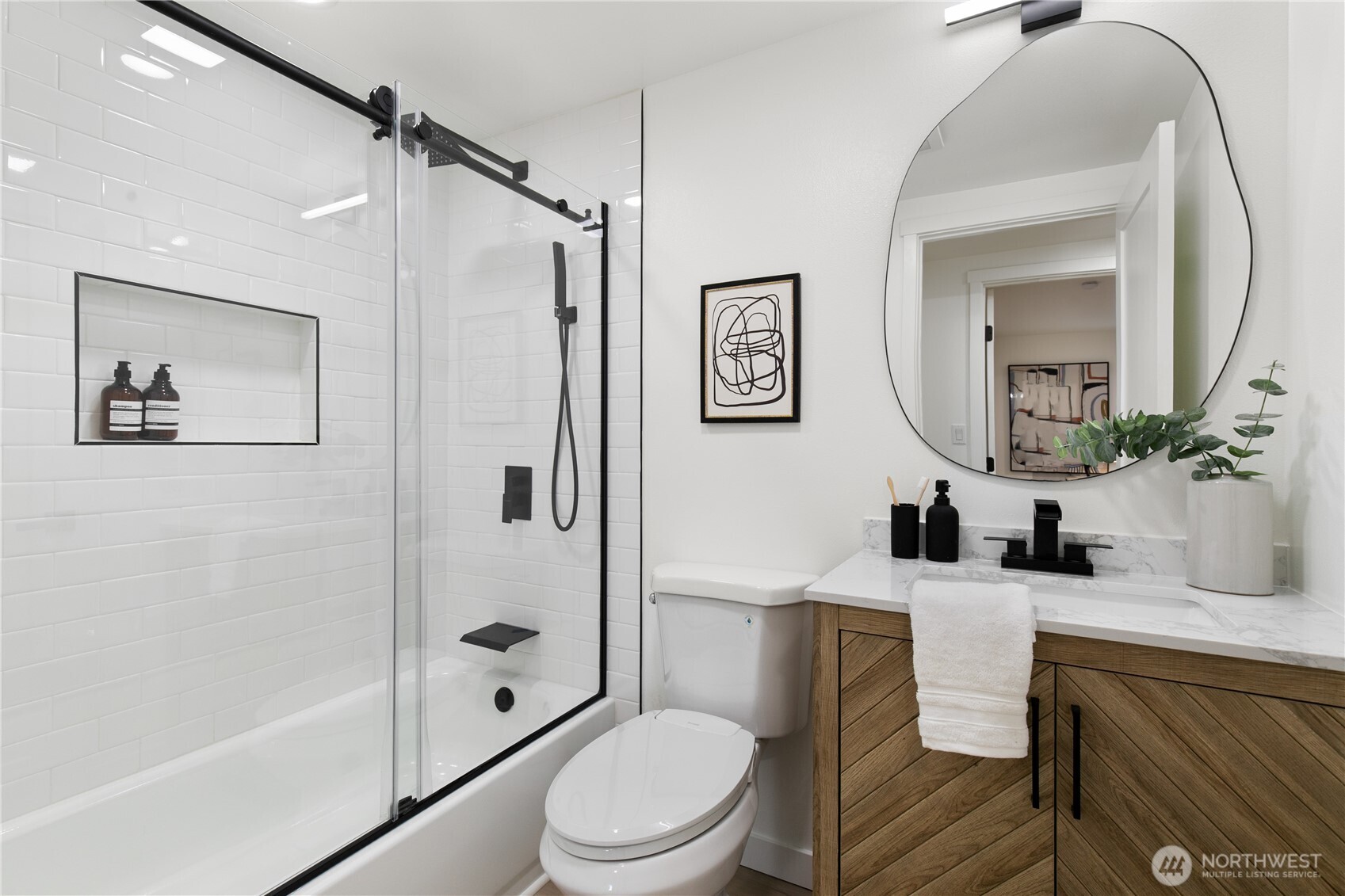 11 Southwest 100th Street Seattle, WA 98146 - Photo 18 of 36 a bathroom with a toilet a sink and a mirror