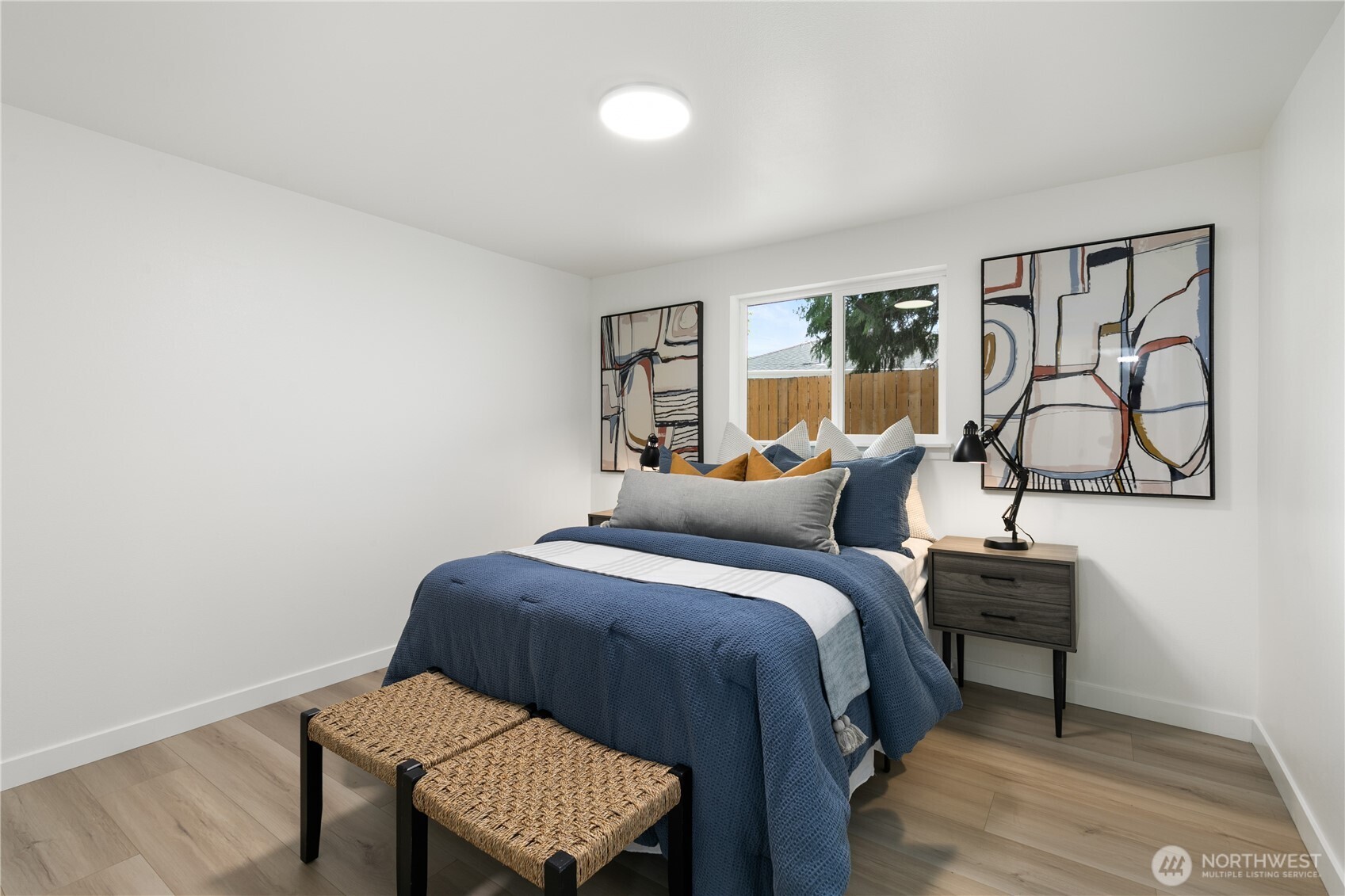 11 Southwest 100th Street Seattle, WA 98146 - Photo 19 of 36 a bed room with a bed window and a chair