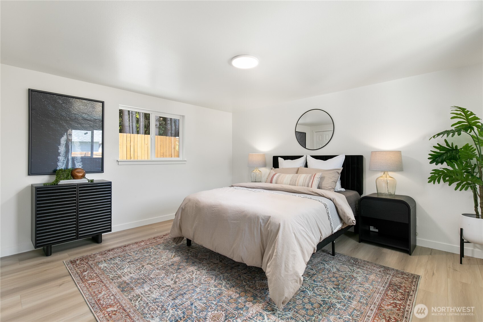 11 Southwest 100th Street Seattle, WA 98146 - Photo 20 of 36 a bedroom with a bed and a potted plant