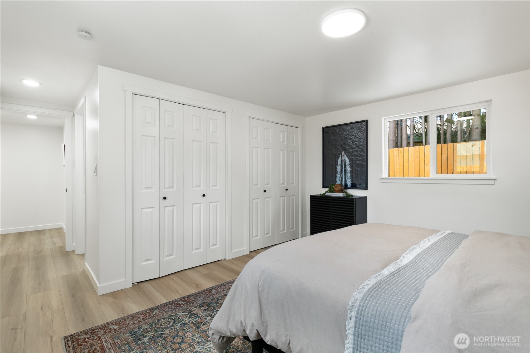 11 Southwest 100th Street Seattle, WA 98146 - Photo 21 of 36 a bedroom with a bed and a window