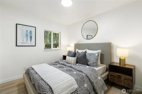 a bedroom with a bed and a lamp