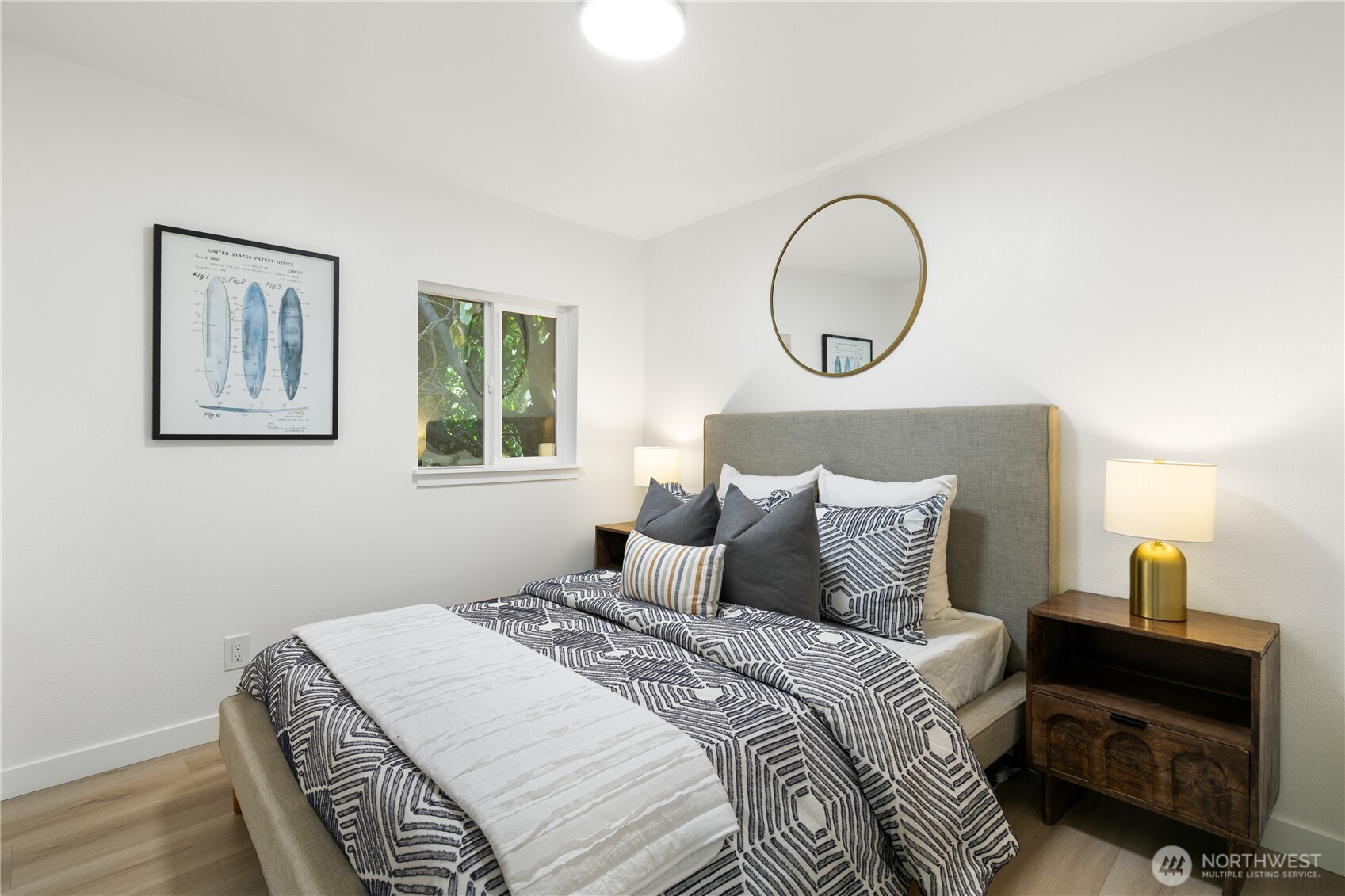 11 Southwest 100th Street Seattle, WA 98146 - Photo 28 of 36 a bedroom with a bed and a lamp