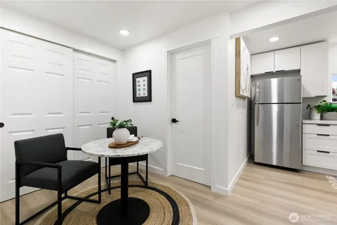 a view of a dining room with furniture and wooden floor