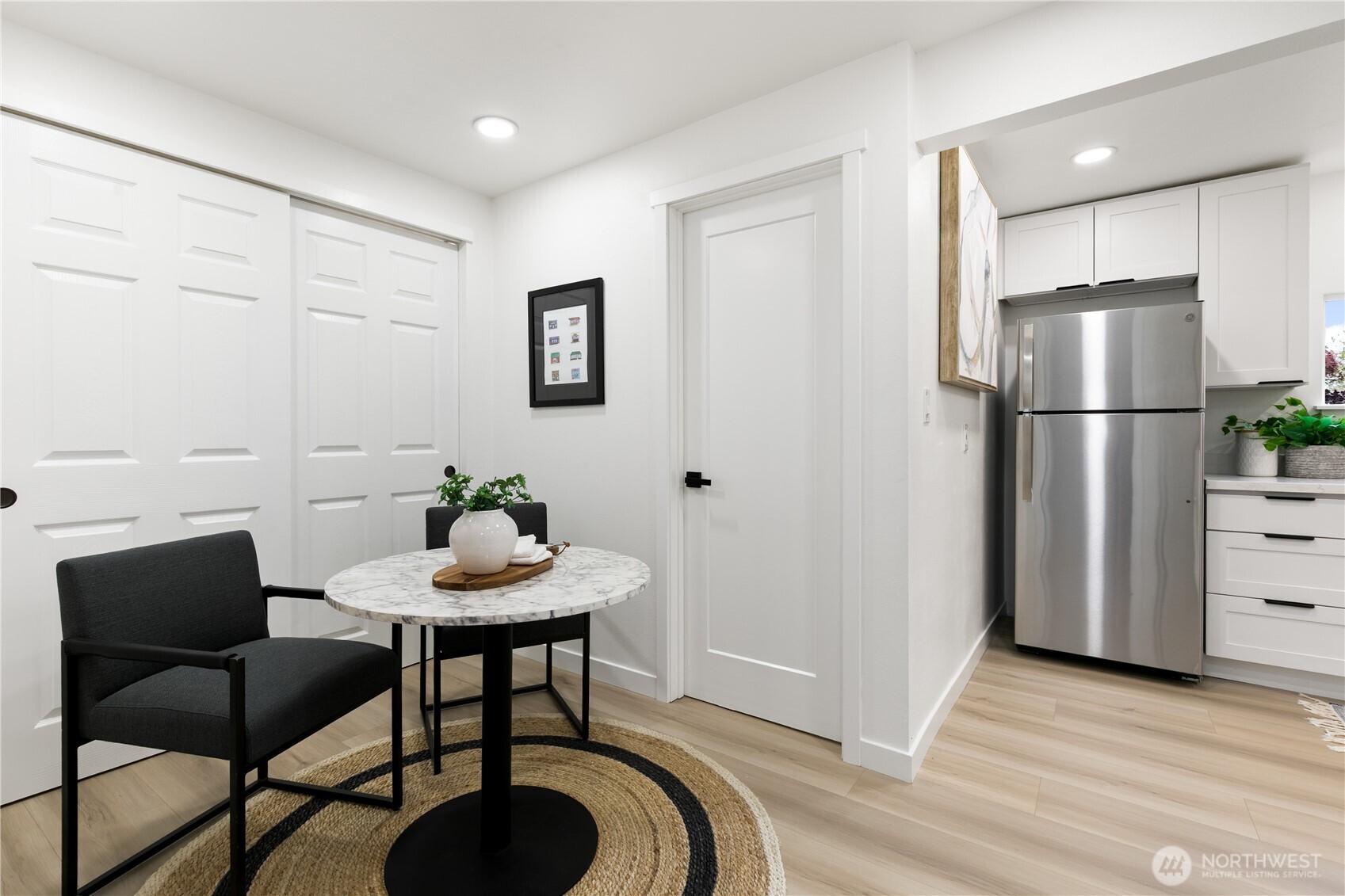 11 Southwest 100th Street Seattle, WA 98146 - Photo 30 of 36 a view of a dining room with furniture and wooden floor