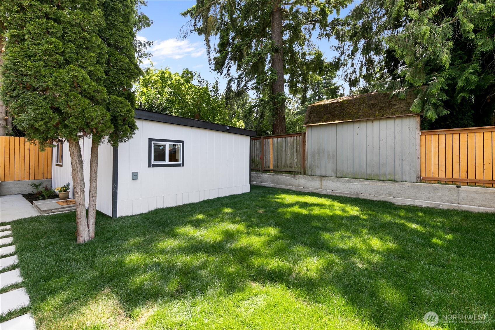 11 Southwest 100th Street Seattle, WA 98146 - Photo 32 of 36 a view of a backyard with a tree