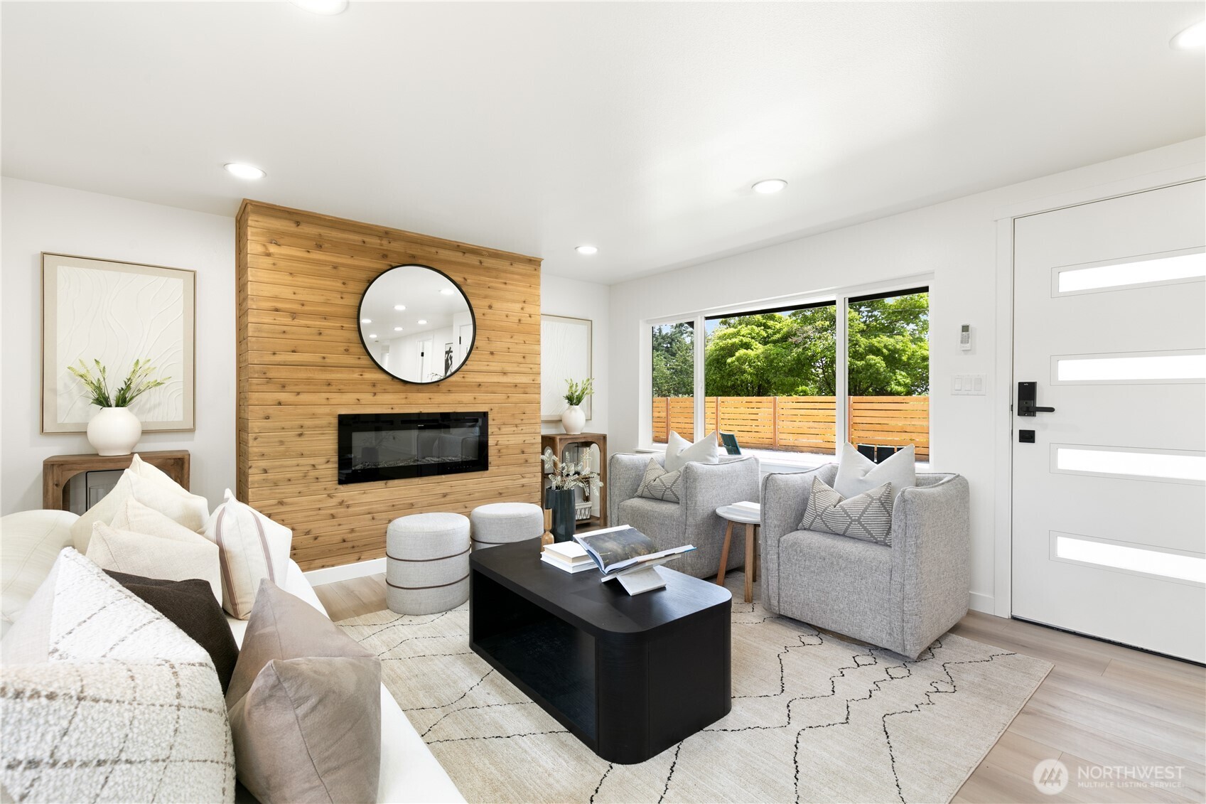 11 Southwest 100th Street Seattle, WA 98146 - Photo 5 of 36 a living room with furniture a large window and a fireplace