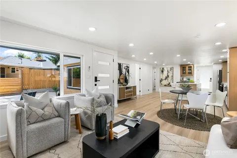 a living room with furniture and a table