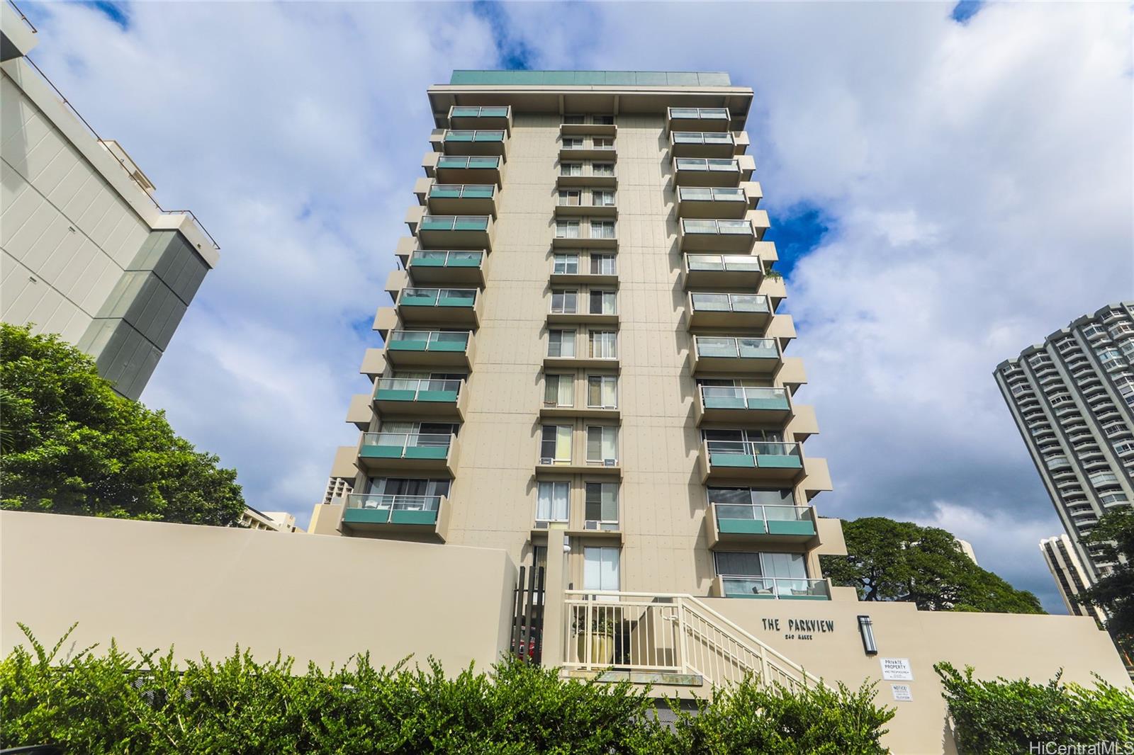240 Makee Road, Unit 11D Honolulu, HI 96815 - Photo 1 of 1 a front view of a multi story building with yard