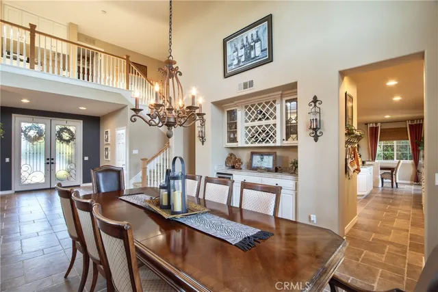 a kitchen with stainless steel appliances granite countertop a refrigerator a sink a stove and island