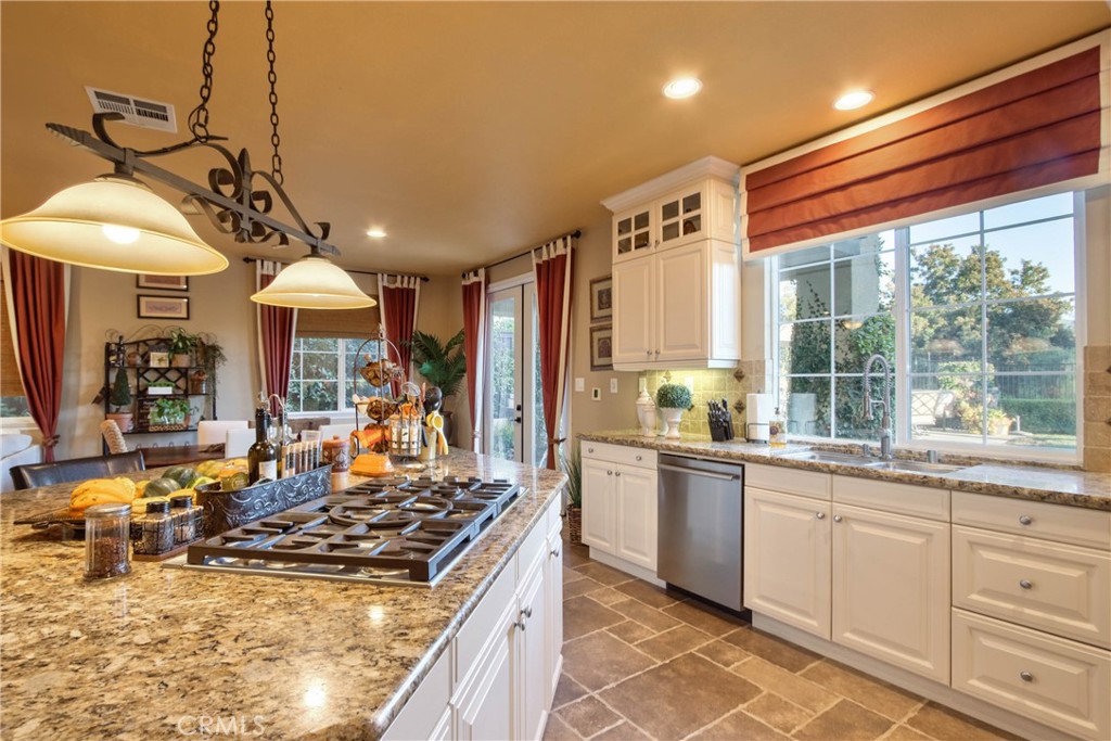 32815 Cleveland Street Temecula, CA 92592 - Photo 17 of 71 a kitchen with lots of counter top space and wooden floor