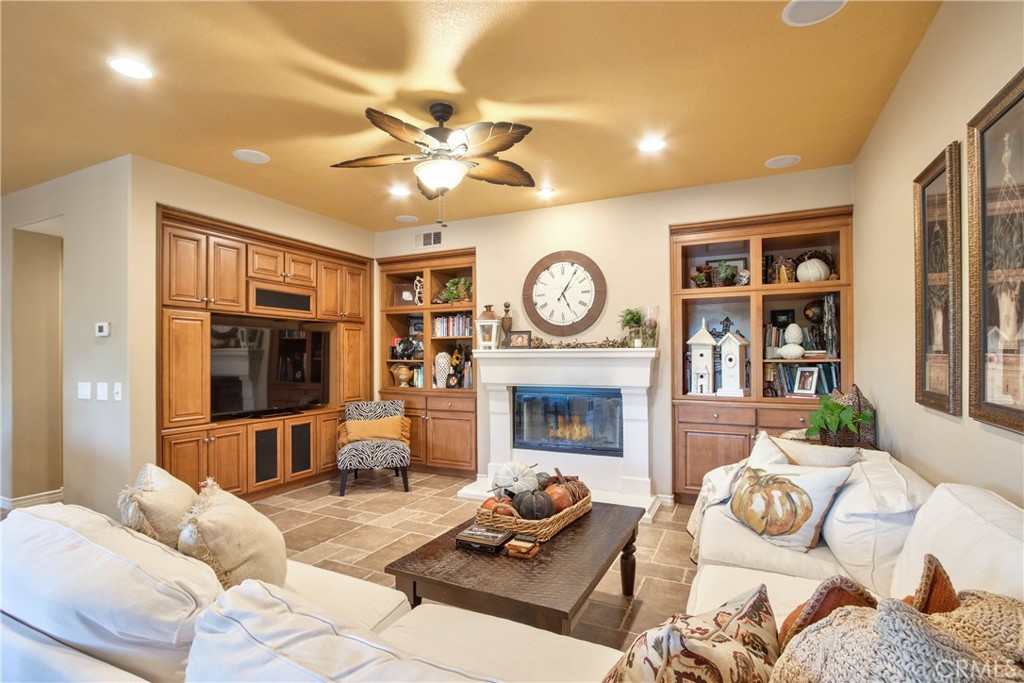 32815 Cleveland Street Temecula, CA 92592 - Photo 20 of 71 a living room with furniture and a fireplace