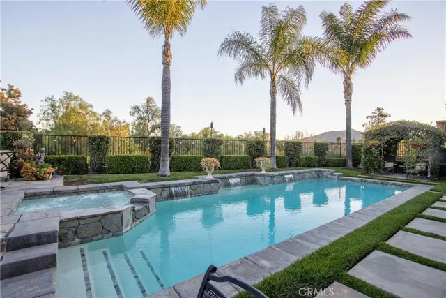 a view of a swimming pool with a table and chairs