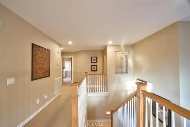 a spacious bathroom with a granite countertop sink mirror and a bathtub