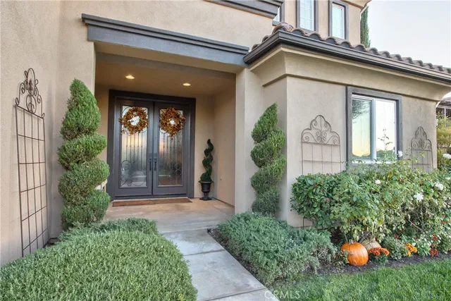 a view of a dining room with furniture and a chandelier