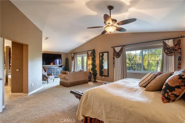 a view of a house with swimming pool and sitting area