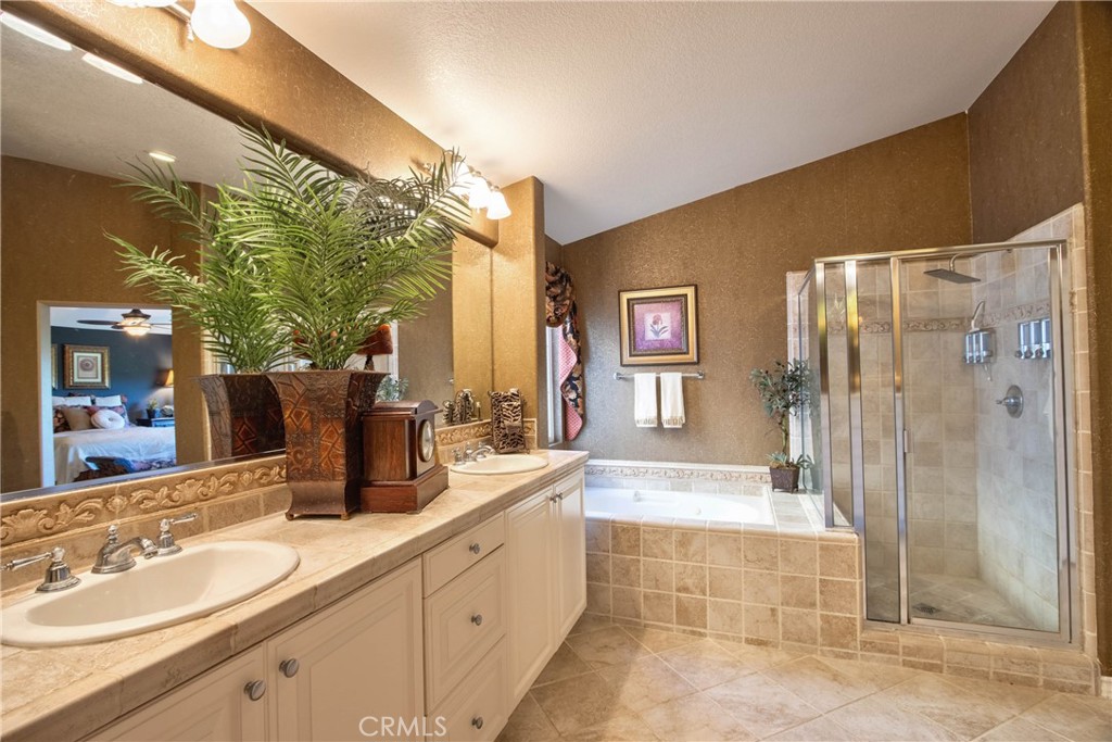 32815 Cleveland Street Temecula, CA 92592 - Photo 44 of 71 a spacious bathroom with a double vanity sink mirror and shower