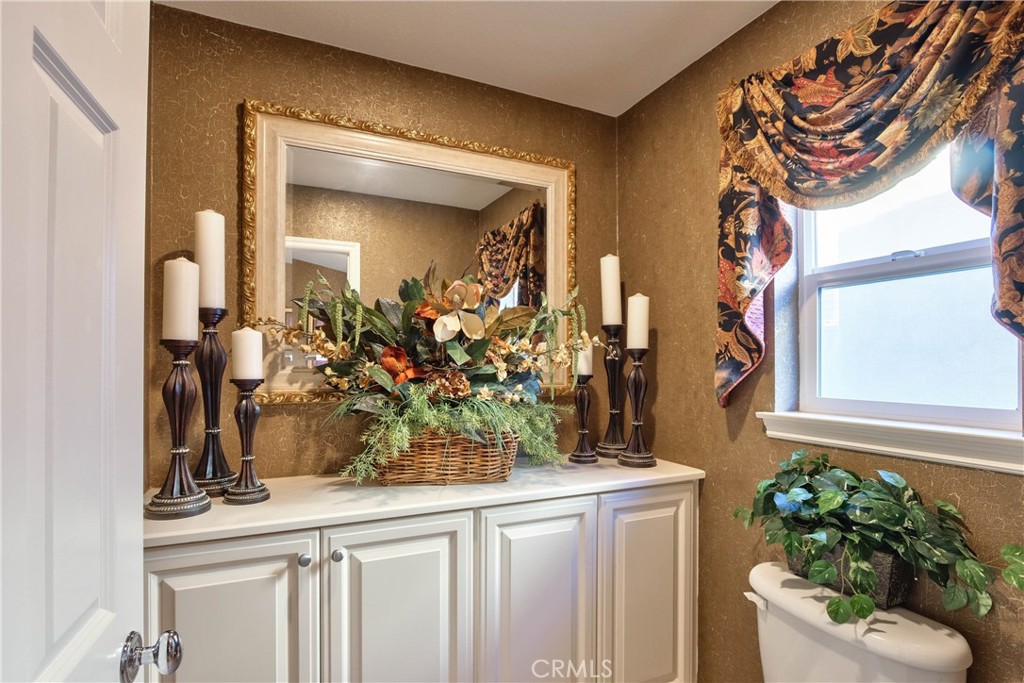 32815 Cleveland Street Temecula, CA 92592 - Photo 46 of 71 a bathroom with a sink and a mirror