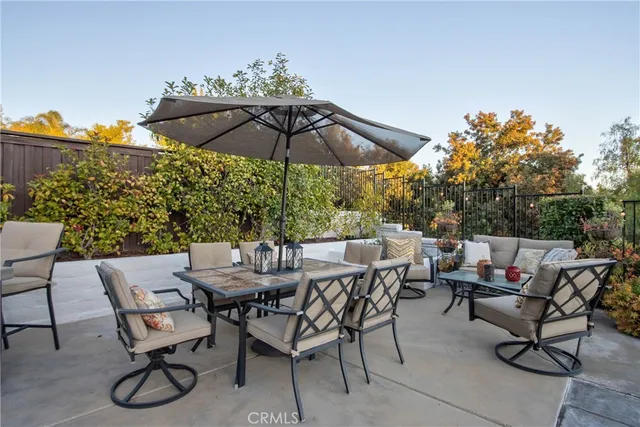 a front view of two house with potted plants