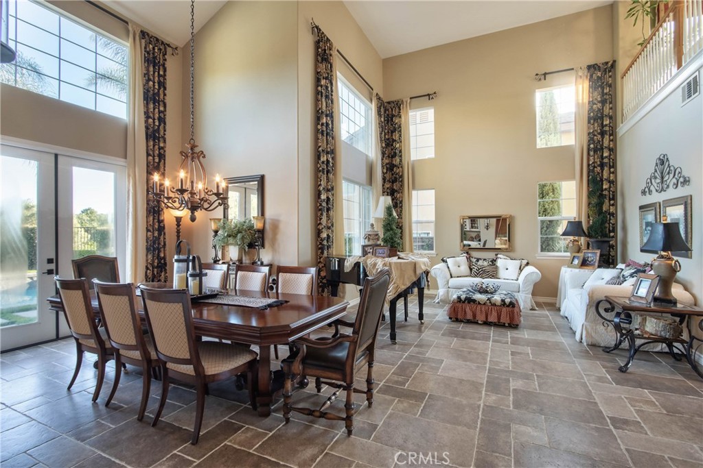 32815 Cleveland Street Temecula, CA 92592 - Photo 7 of 71 a view of a dining room with furniture and a chandelier