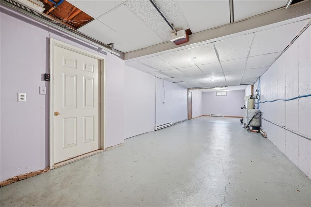 74 Swiss View Road Lehighton, PA 18235 - Photo 51 of 59 An expansive basement area features concrete flooring and a drop tile ceiling structure.