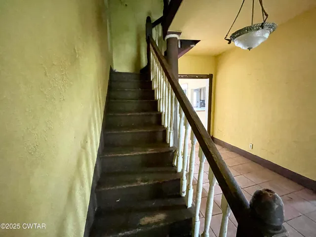 a view of a hallway with a chandelier