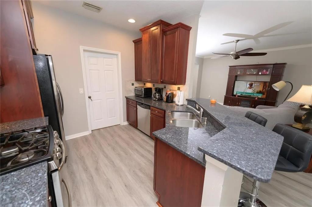 2707 Kilgore Street Orlando, FL 32803 - Photo 4 of 9 a kitchen with sink refrigerator and stove