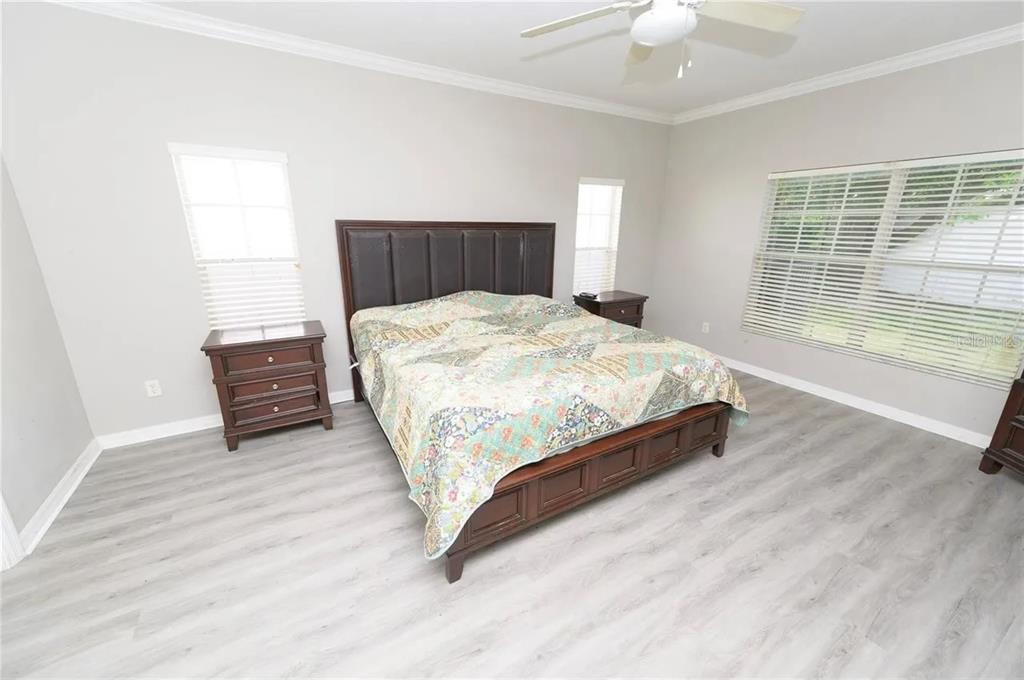 2707 Kilgore Street Orlando, FL 32803 - Photo 5 of 9 a spacious bedroom with a bed and a window