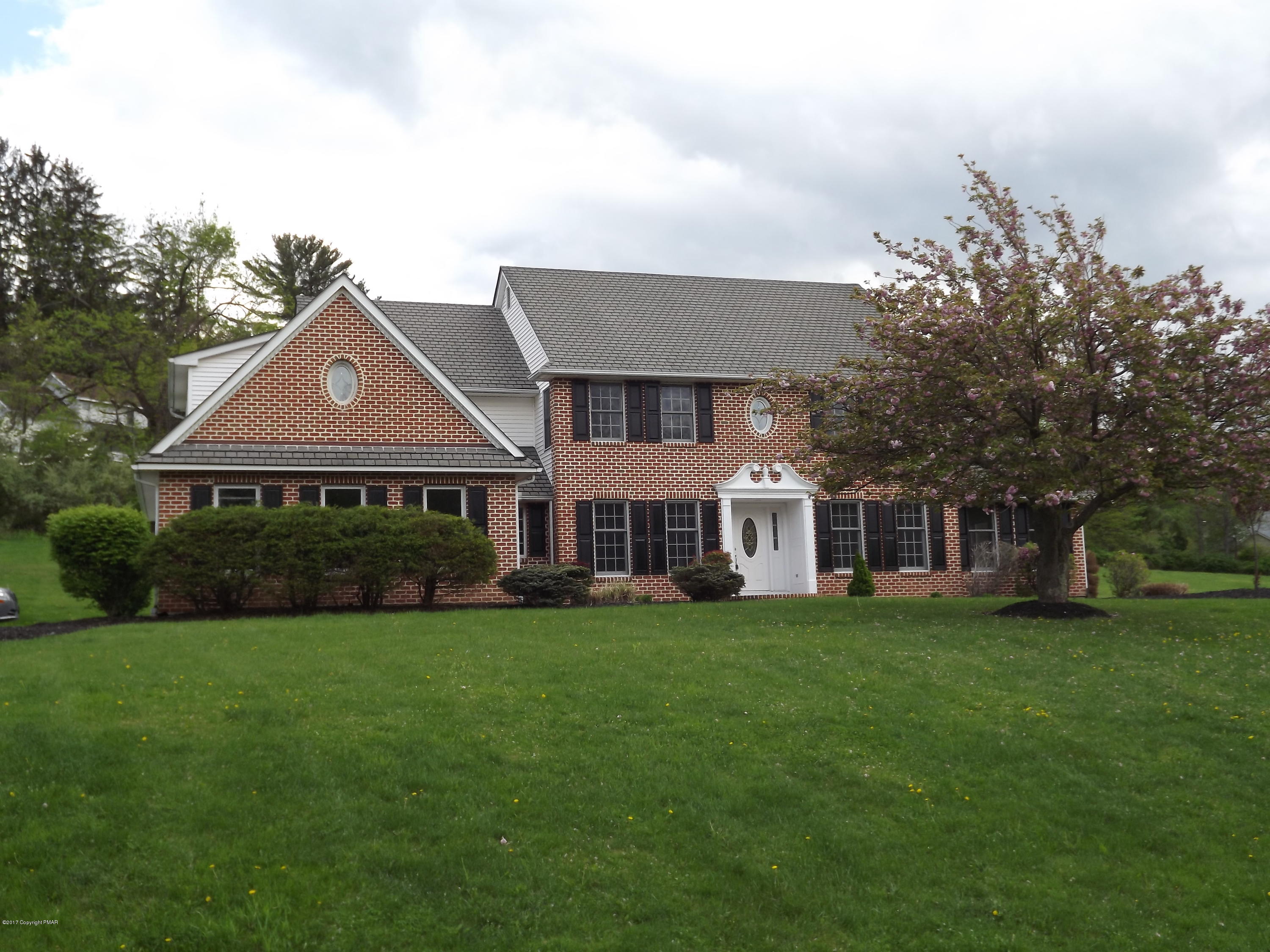 2111 Fox Run Road Stroudsburg, PA 18360 - Photo 1 of 72 a front view of a house with a garden