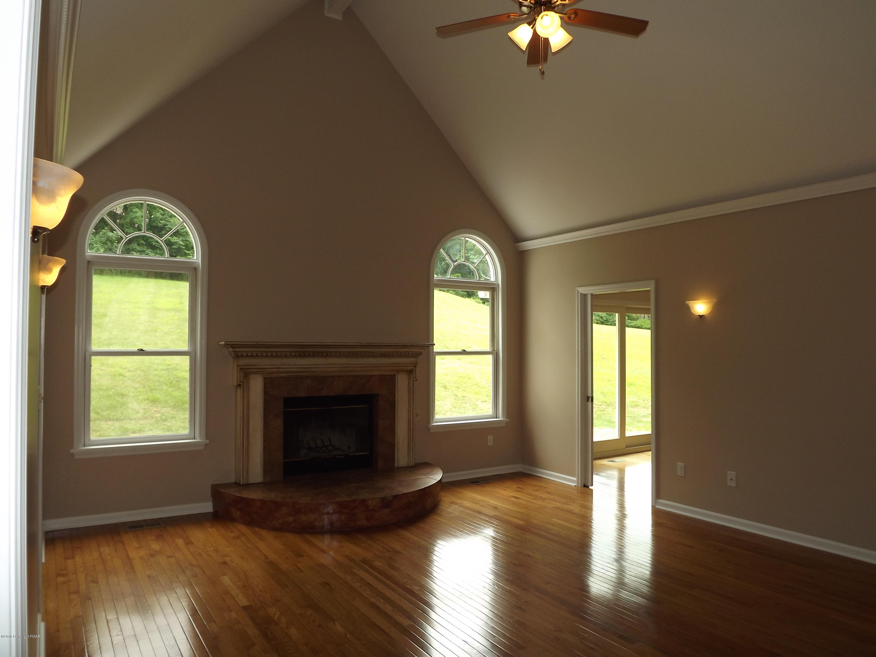 2111 Fox Run Road Stroudsburg, PA 18360 - Photo 17 of 72 a view of an empty room with a window and wooden floor