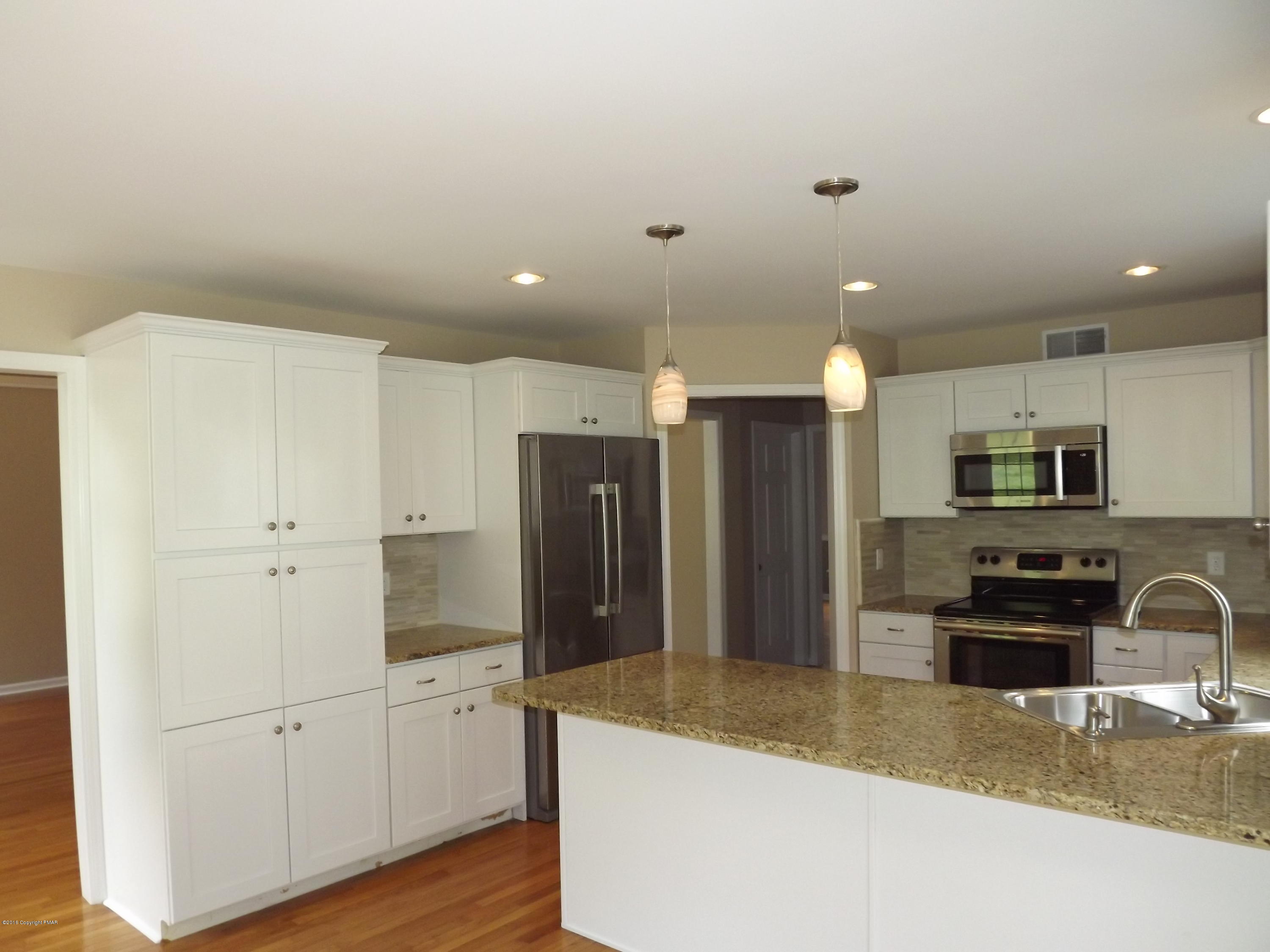 2111 Fox Run Road Stroudsburg, PA 18360 - Photo 26 of 72 a kitchen with stainless steel appliances granite countertop a refrigerator a stove and a sink