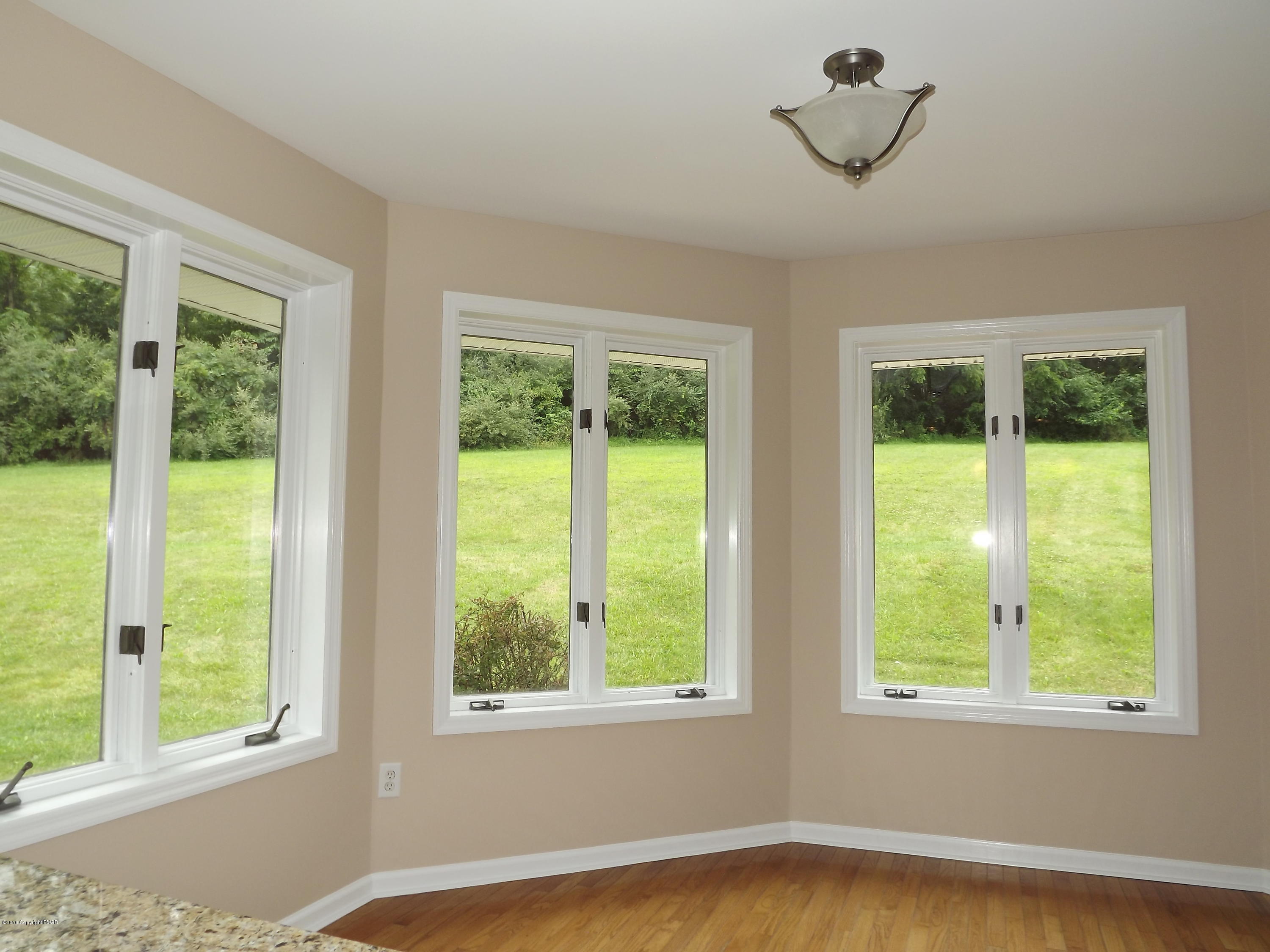 2111 Fox Run Road Stroudsburg, PA 18360 - Photo 28 of 72 a view of an empty room with wooden floor and a window