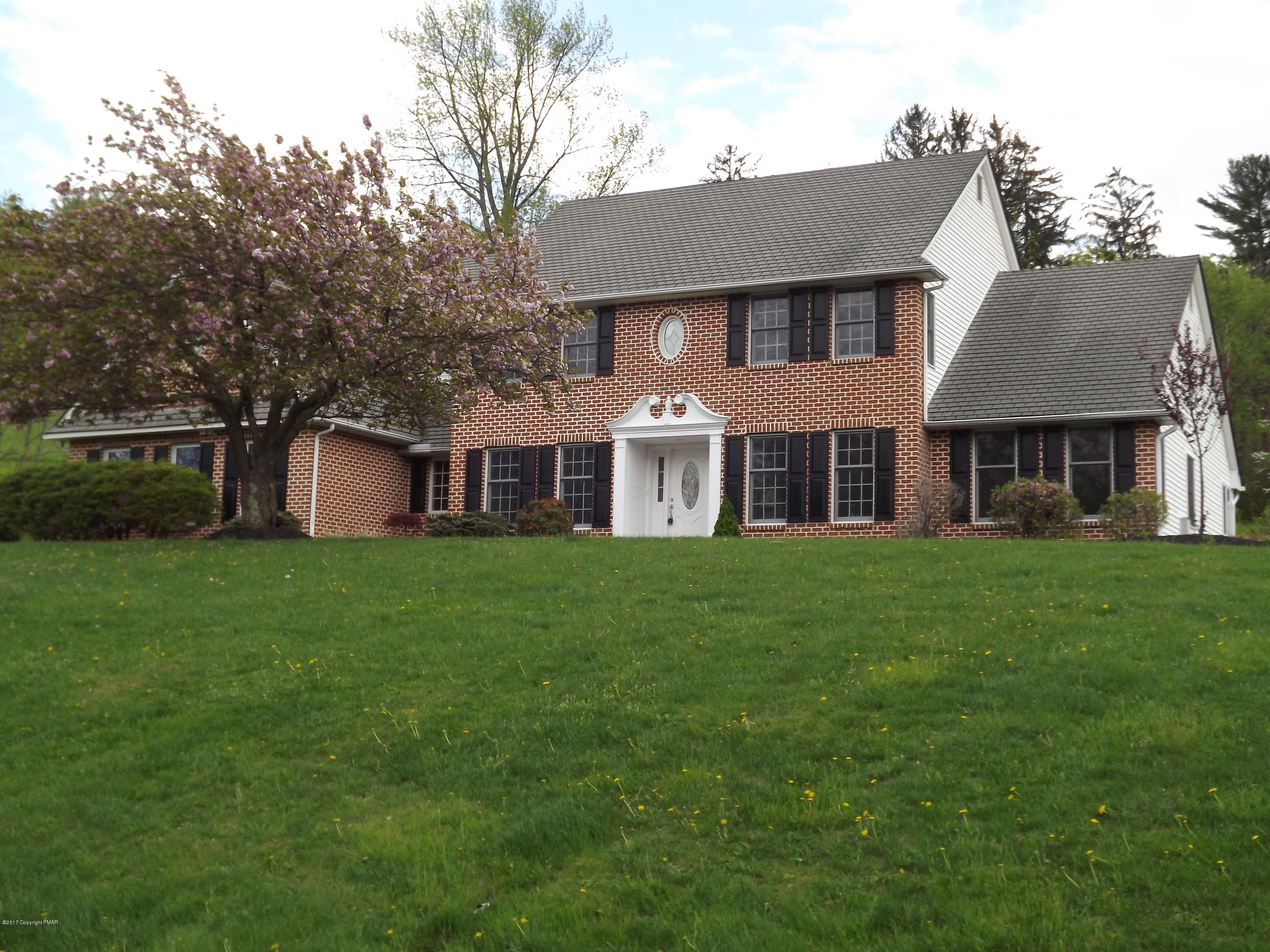 2111 Fox Run Road Stroudsburg, PA 18360 - Photo 3 of 72 a front view of a house with a yard