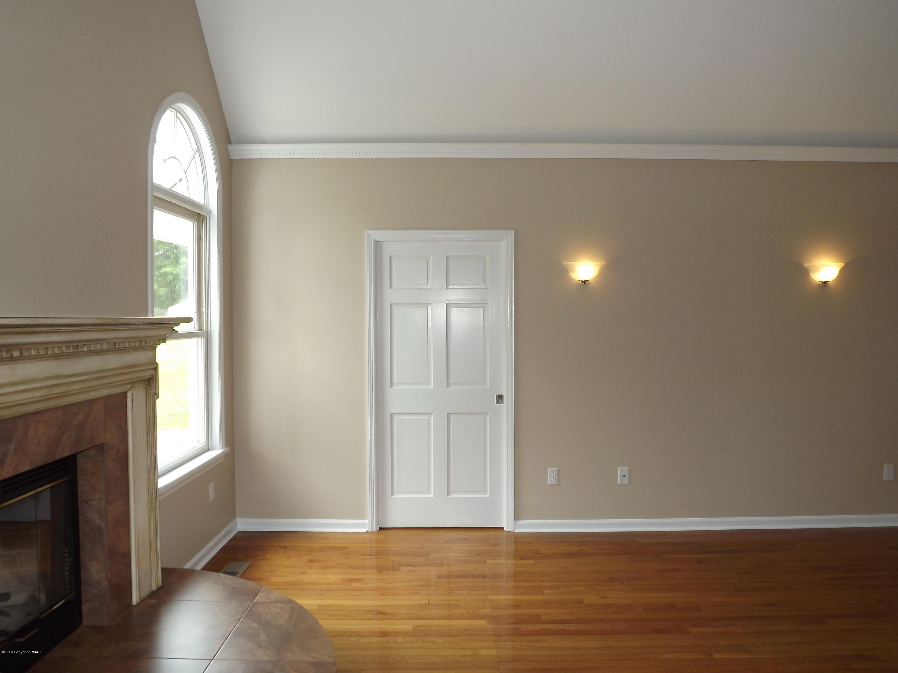 2111 Fox Run Road Stroudsburg, PA 18360 - Photo 31 of 72 a view of empty room with wooden floor and fireplace