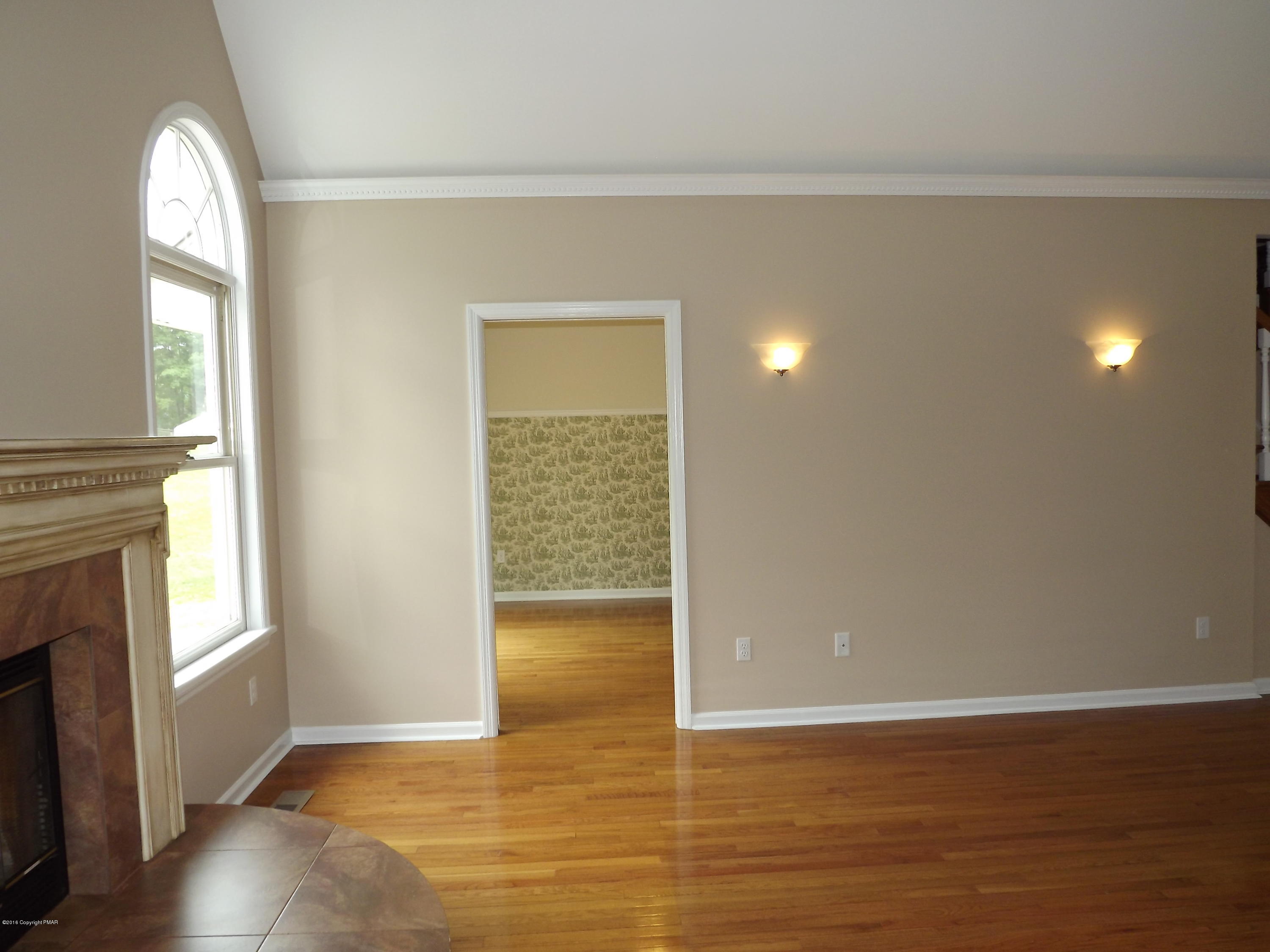 2111 Fox Run Road Stroudsburg, PA 18360 - Photo 32 of 72 a view of an empty room with wooden floor and a window