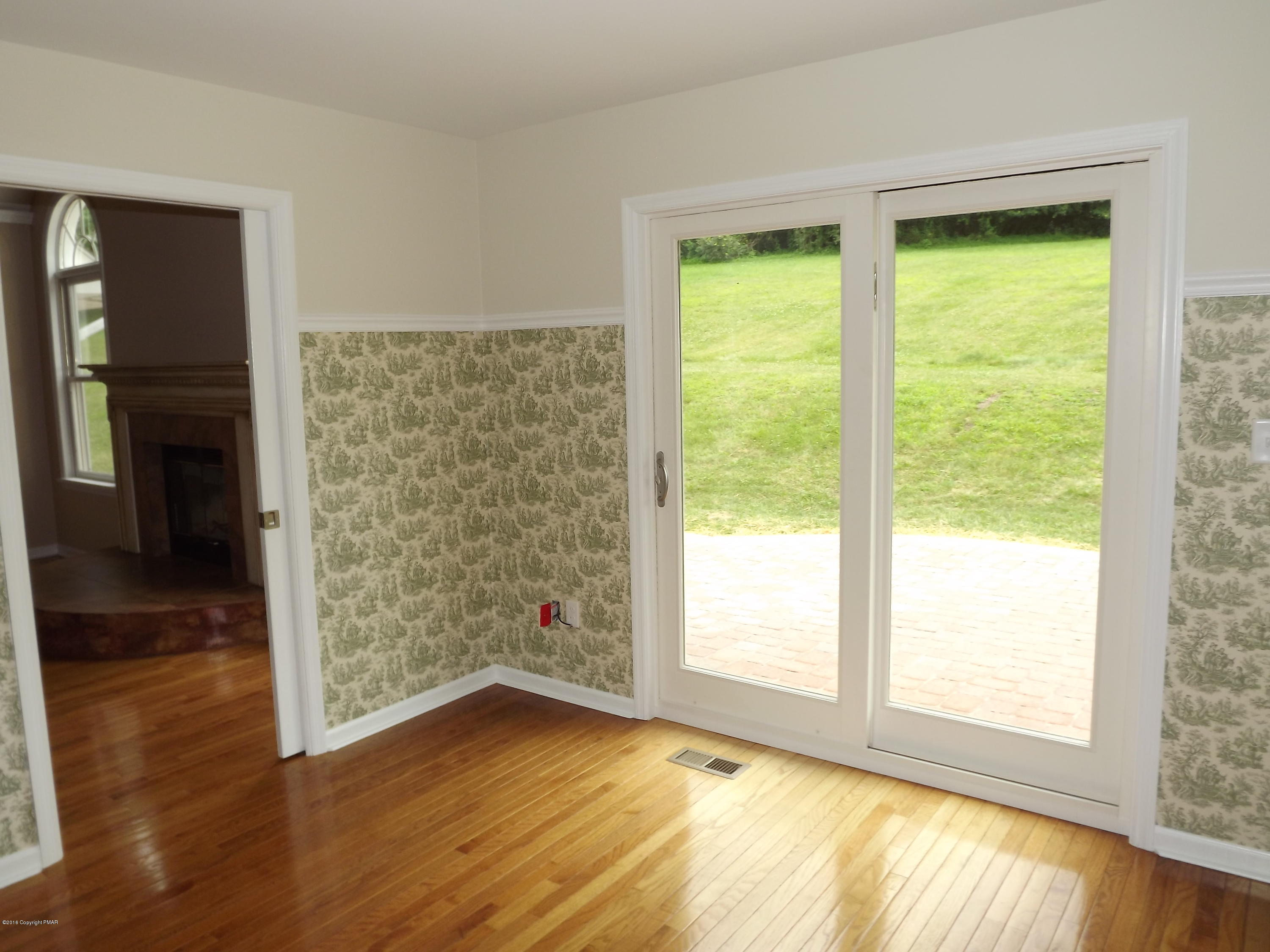 2111 Fox Run Road Stroudsburg, PA 18360 - Photo 34 of 72 a view of an empty room with wooden floor and a window