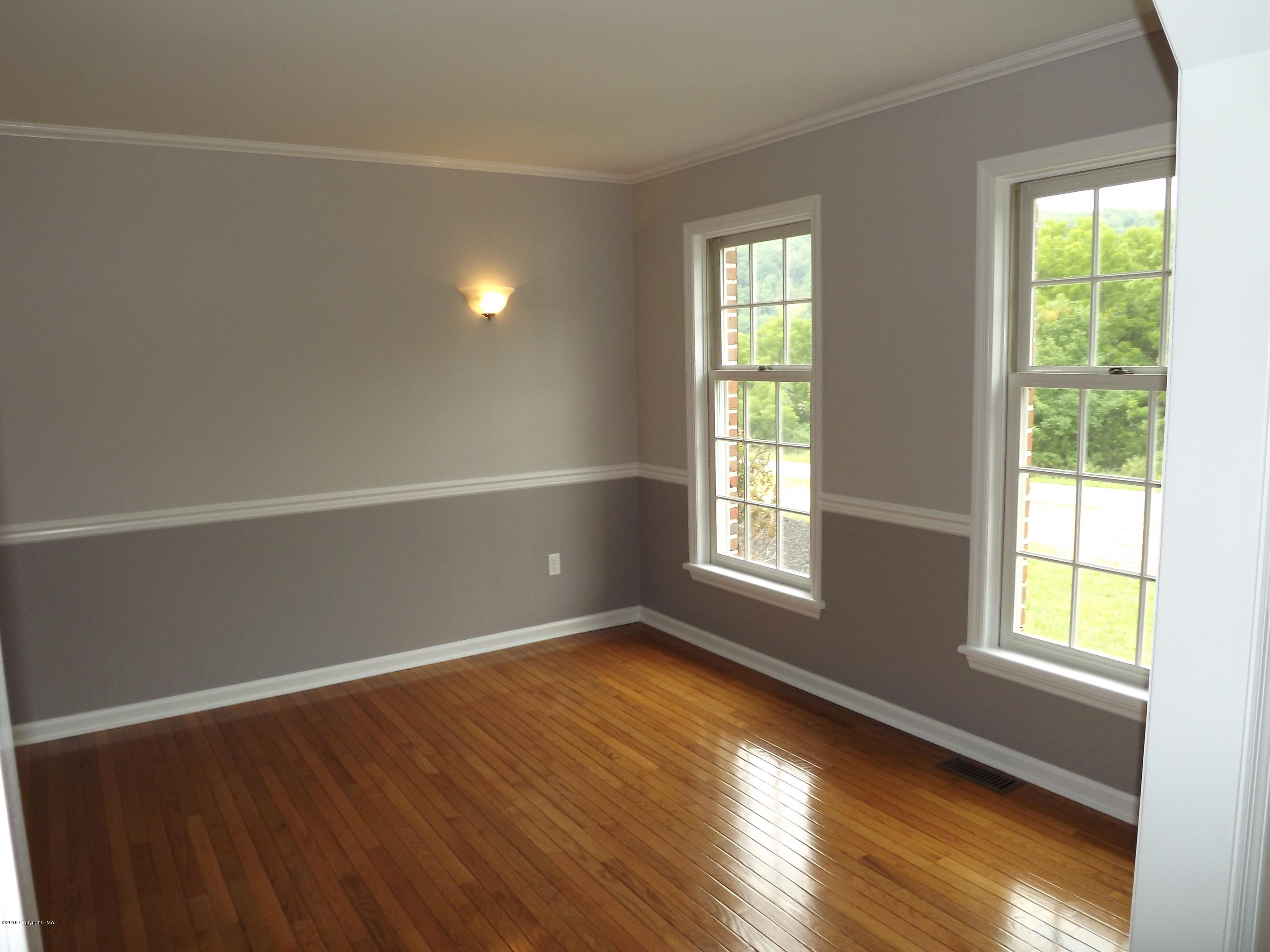 2111 Fox Run Road Stroudsburg, PA 18360 - Photo 35 of 72 a view of an empty room with wooden floor and a window