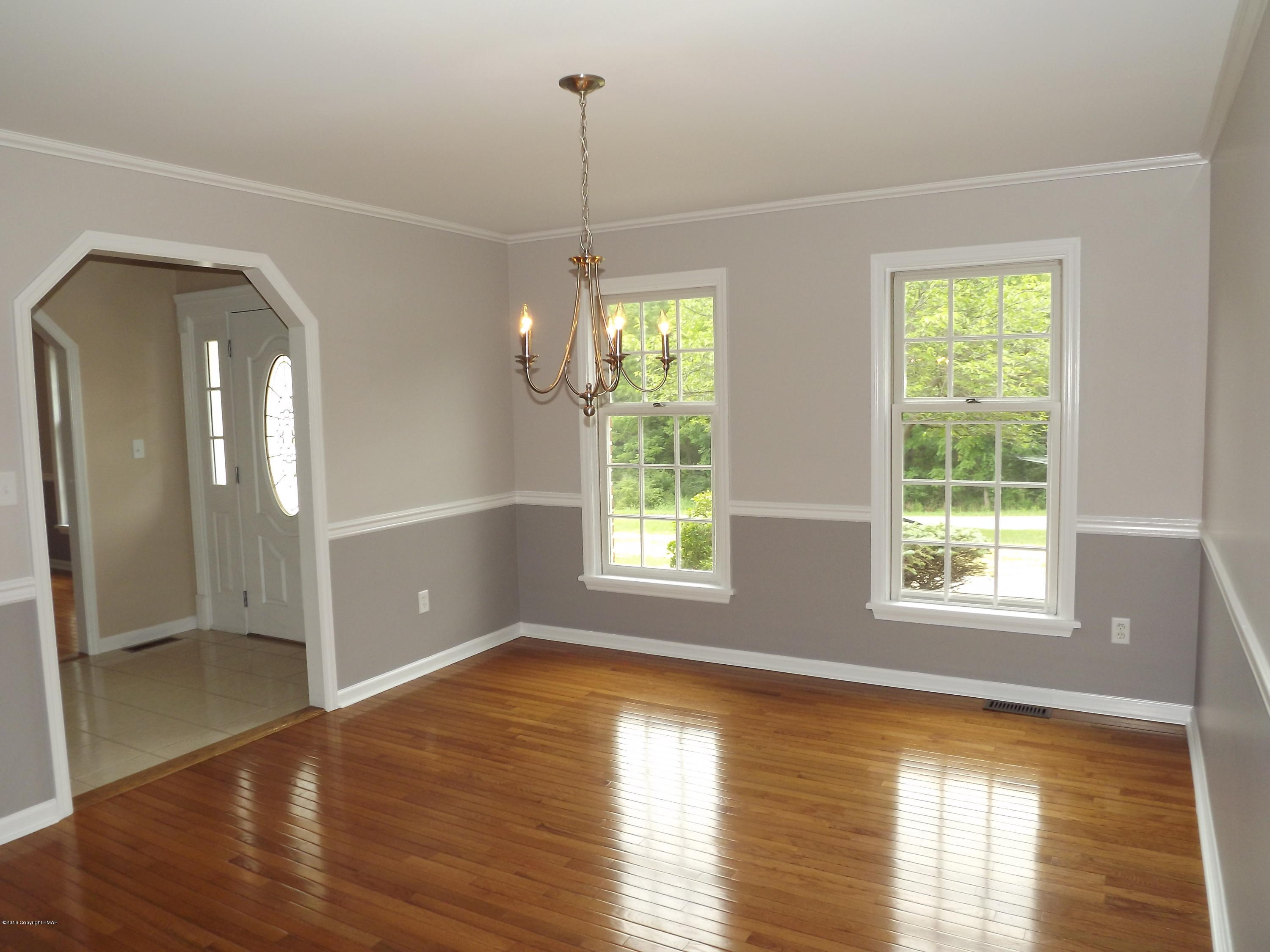 2111 Fox Run Road Stroudsburg, PA 18360 - Photo 40 of 72 a view of an empty room with wooden floor and a window