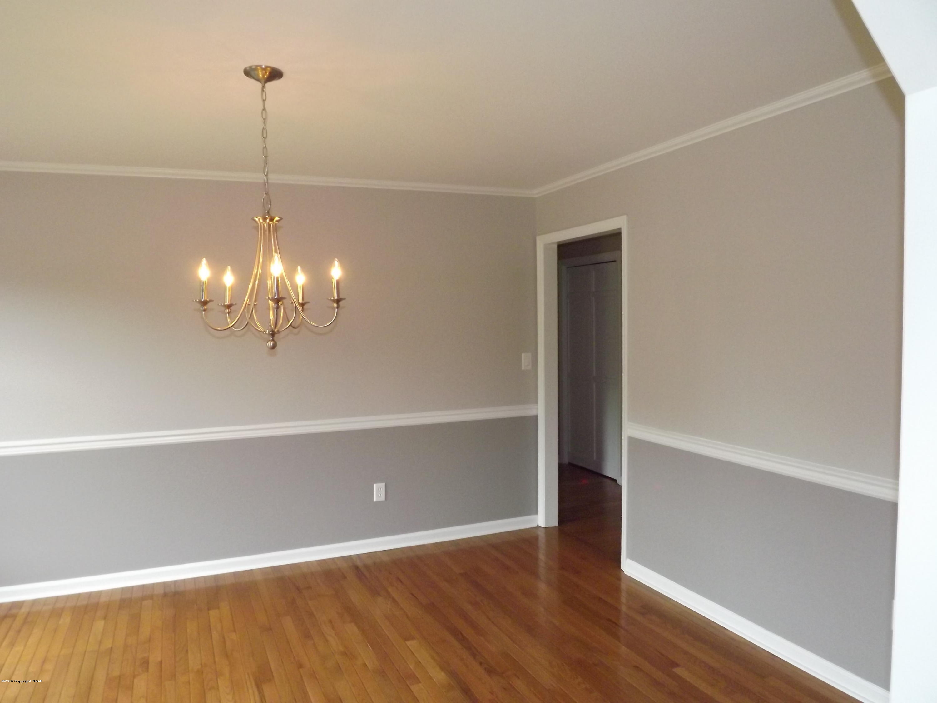 2111 Fox Run Road Stroudsburg, PA 18360 - Photo 42 of 72 a view of a room with wooden floor chandelier and entryway