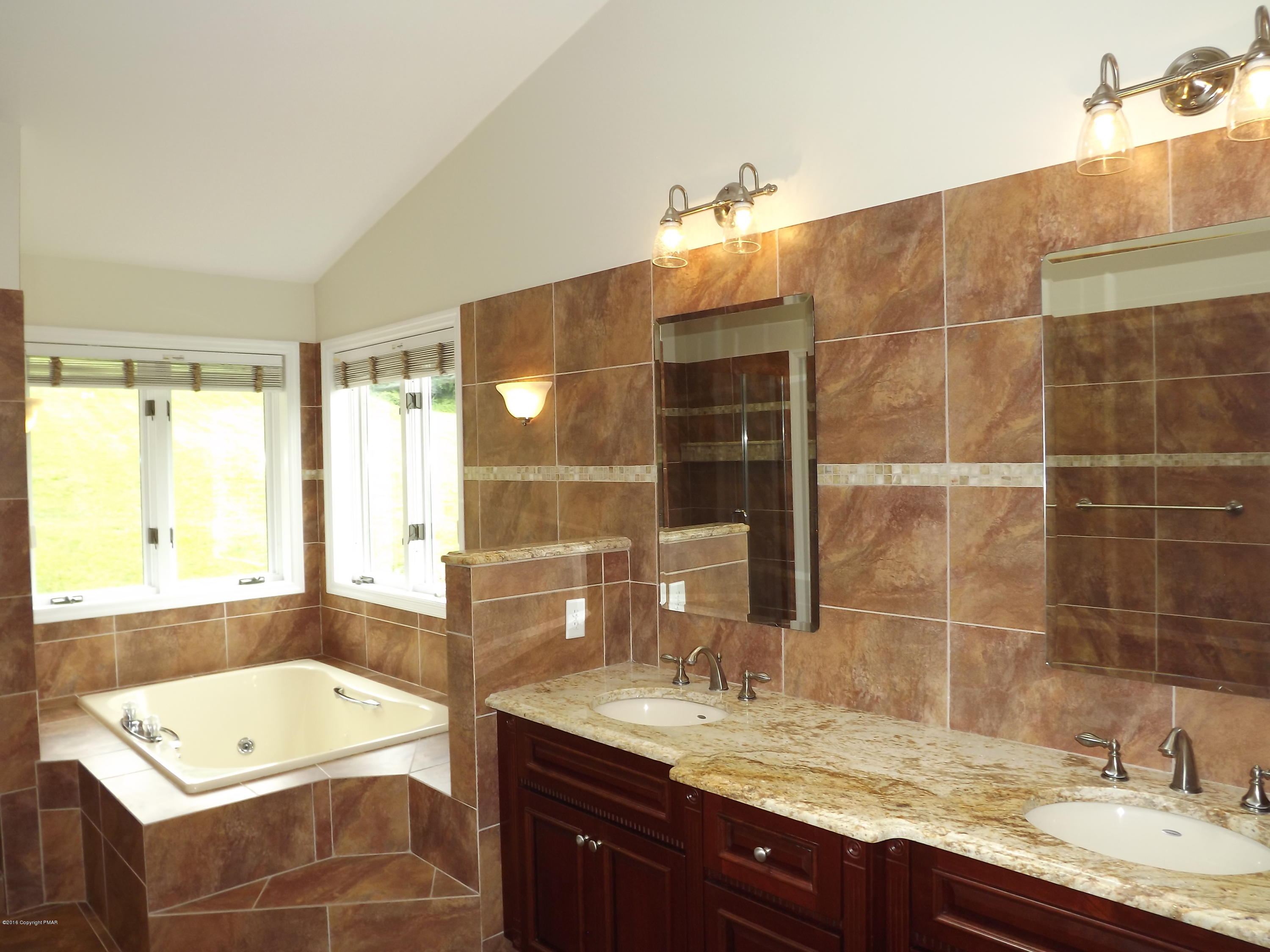 2111 Fox Run Road Stroudsburg, PA 18360 - Photo 46 of 72 a bathroom with a granite countertop sink and a bathtub