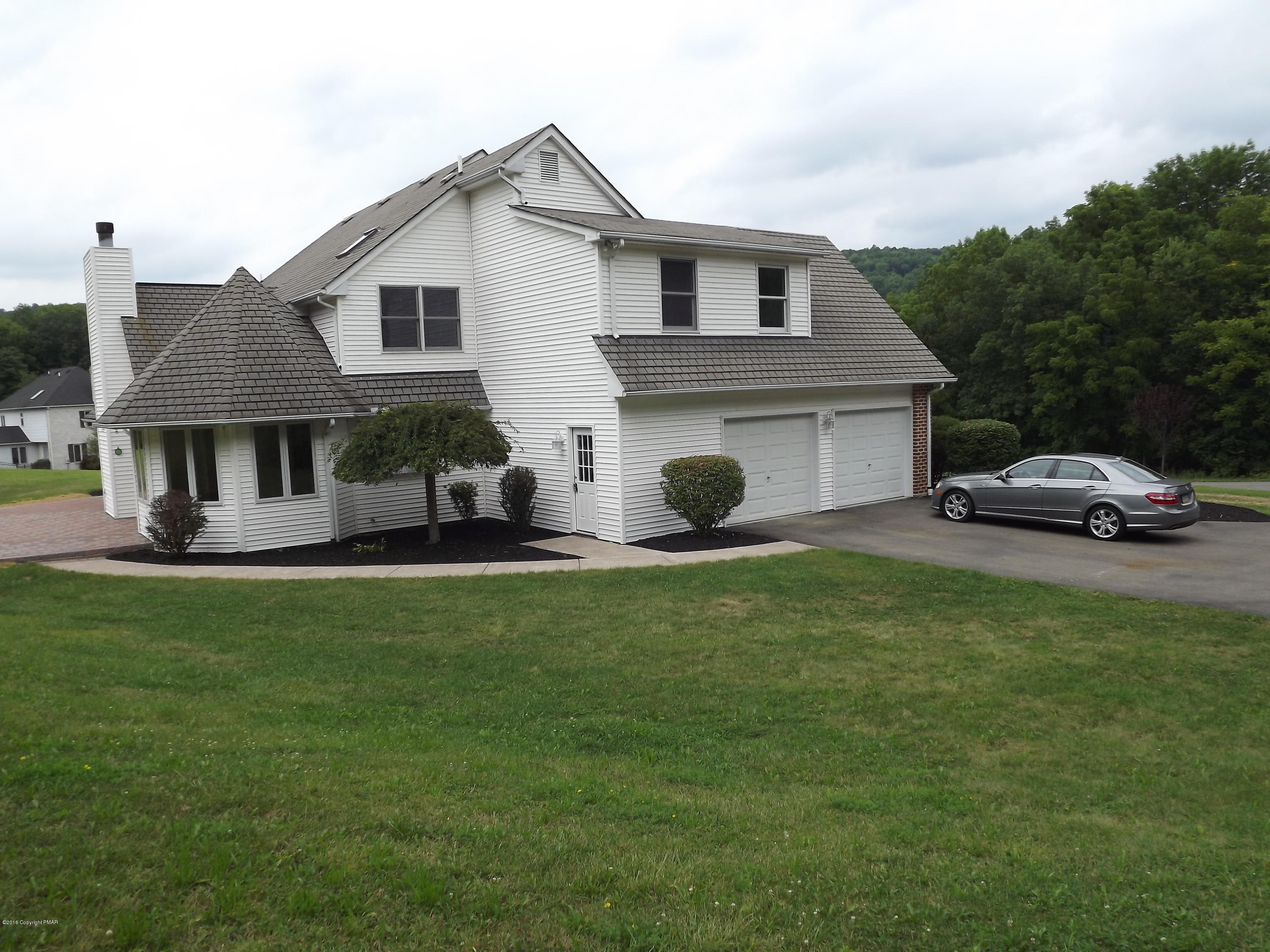 2111 Fox Run Road Stroudsburg, PA 18360 - Photo 8 of 72 a front view of a house with a garden