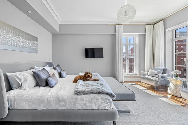 a view of entryway with livingroom and chandelier
