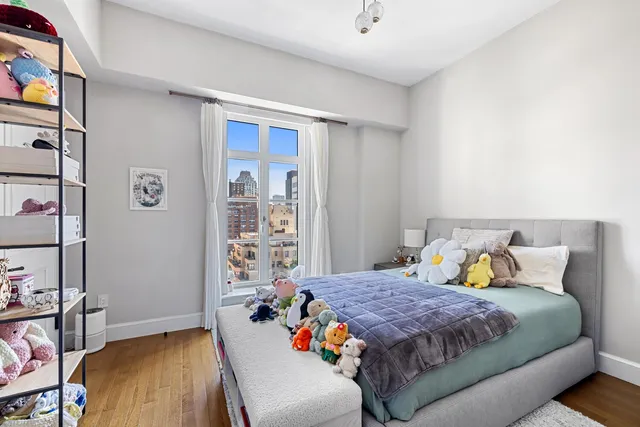 a bathroom with a double vanity sink toilet mirror and shower