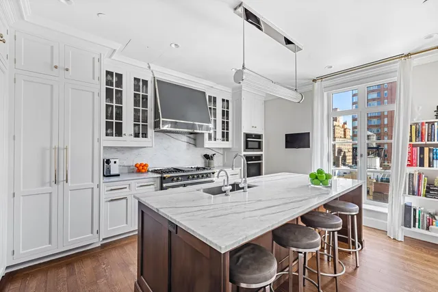 a view of a balcony with two chairs and a table