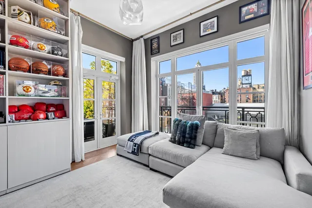 a kitchen that has a table chairs and wooden floor
