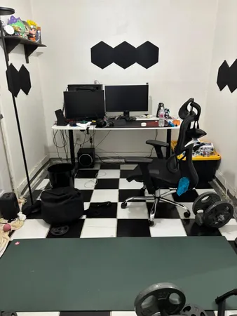 a room with furniture and gym equipment