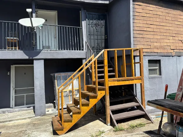 a view of balcony with furniture